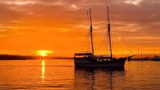 Golden Hour Magic: Vintage Boat Crossing Oslo Fjord