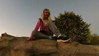 Climbing on the big rock in the Tumbleweed park
