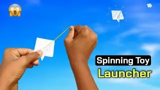 notebook paper flying spinner, rubber band spinning toy, make flying spiner toy, notebook launcher
