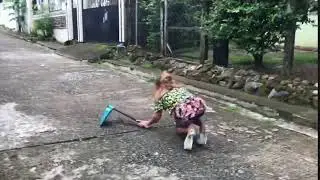 Filipino Girl FALLS while trying to garden in platform shoes!