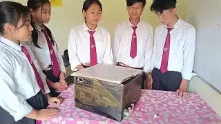 Solar dryer (prototype) with a mini fan installed for removing moisture during drying process. 