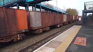 Class 66 063 empty iron ore train through Barnetby