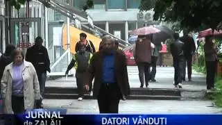Romanii datori vanduti
