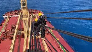 Greasing ship’s crane