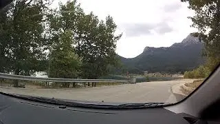 Driving on a scenic route along Lake Doxa (mountain road driving, Greece) - onboard camera
