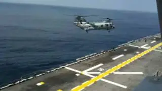Helicopter Landing on Aircraft Carrier