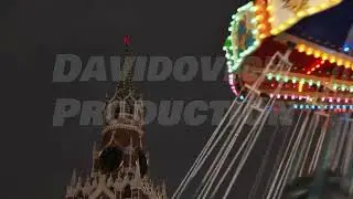 Spasskaya Tower of Moscow Kremlin and spinning carousel at night