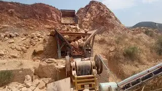 Truck is unloading into big rocks jaw crusher | incredible work by jaw crusher