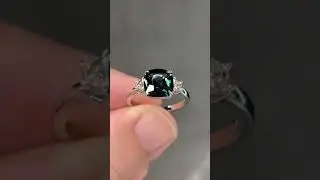 Unheated teal sapphire ring indoors