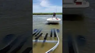putting our new Mako 17 pro skiff on the trailer without guides. (I got some guides the next day)