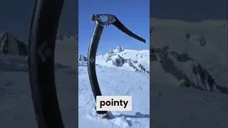 The ice axe, a symbol of mountaineering, is essential for balance and safety on glaciated peaks.