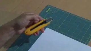 Left-handed craft knives and safety cutters
