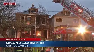 Crews fight second-alarm fire in two homes