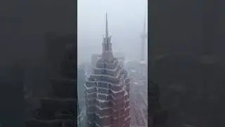 Standing at the top of the Shanghai World Financial Center