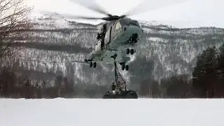 Merlin Mk4 Helicopter Lifts Recon Vehicles Over Snow in Extreme Winter Operation
