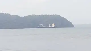 A cargo ship passes near Balaan bukid