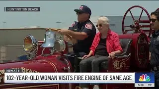 102-year-old woman takes a ride on fire engine of same age