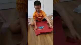 Aaron new task is tidying clothes