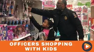Police Officers Take Children Gift Shopping in Annual Holiday Event