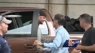 Red Sox owner John Henry hugs Jon Lester