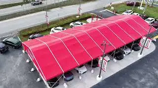 Curve Tent Rental with Red Top for Corporate Events