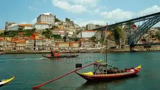 stock footage porto portugal july rabelo port wine boats dot the douro river framing the vibrant
