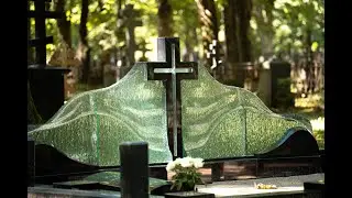 Large family monument in the cemetery &ndash; black granite cross and glass waves by Glasstone.eu