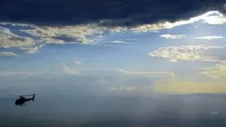 HELICOPTER AND THUNDERSTORM - UNUSUAL EVENT