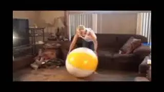 girl sit pop beach ball