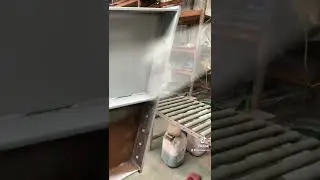 Spray painting grey primer on steel