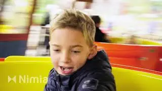 boy riding carousel   1571938