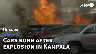 Car burns near Uganda parliament after explosion in Kampala | AFP