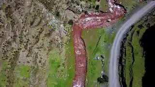 Aerial, top down, drone shot over the pukamayu red river, on a sunny day FREE STOCK VIDEO