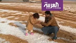 أهالي الجوف يحتفلون بالبرد على طريقتهم