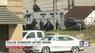 Police locked in standoff in the East Bottoms of KC following crash