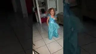 Sweet girl in a princess dress twirling