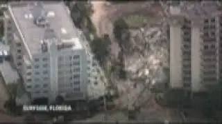 Video shows workers digging through condo rubble