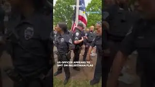 US police officer appears to be spitting on Palestinian flag