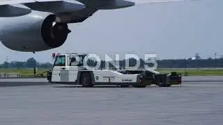 Pushback Tractor - Airport Ramp - Aircraft Tow Tug - 4k Stock Footage