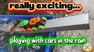 playing with toy cars in the rain