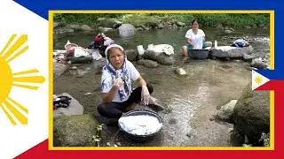 Clothes Washing By Hand In A River-  In The Philippines