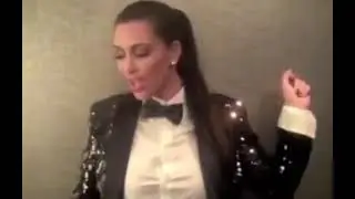 Kim west dancing in a sparkly suit/singing in french