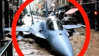 An Unusual Angle Reveals a Fighter Jet in a Flooded City Street