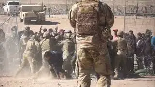 Illegal immigrants broke through a fence with razor wire and rush border patrol in el Paso TX.