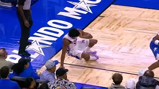VJ Edgecombe heads to the locker room in after being hit in the eye on this play in the 1st quarter