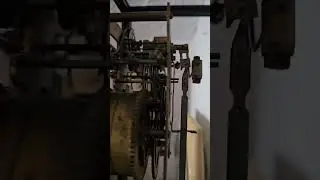 Junghans clock movement in a showcase