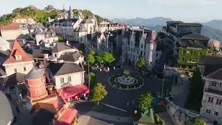 Smooth Aerial Views of Ba Na Hill French Castle Surrounded by Greenery | 4k Video Stock Footage