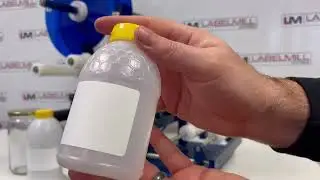 LabelMill LM1012 Semi-Automatic Tabletop Label Applicator System applying labels to various jars.