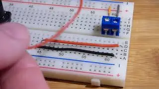 Using an electronics screw terminal block to connect stranded wire to a breadboard