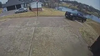 Driver backs truck into North Texas pond
